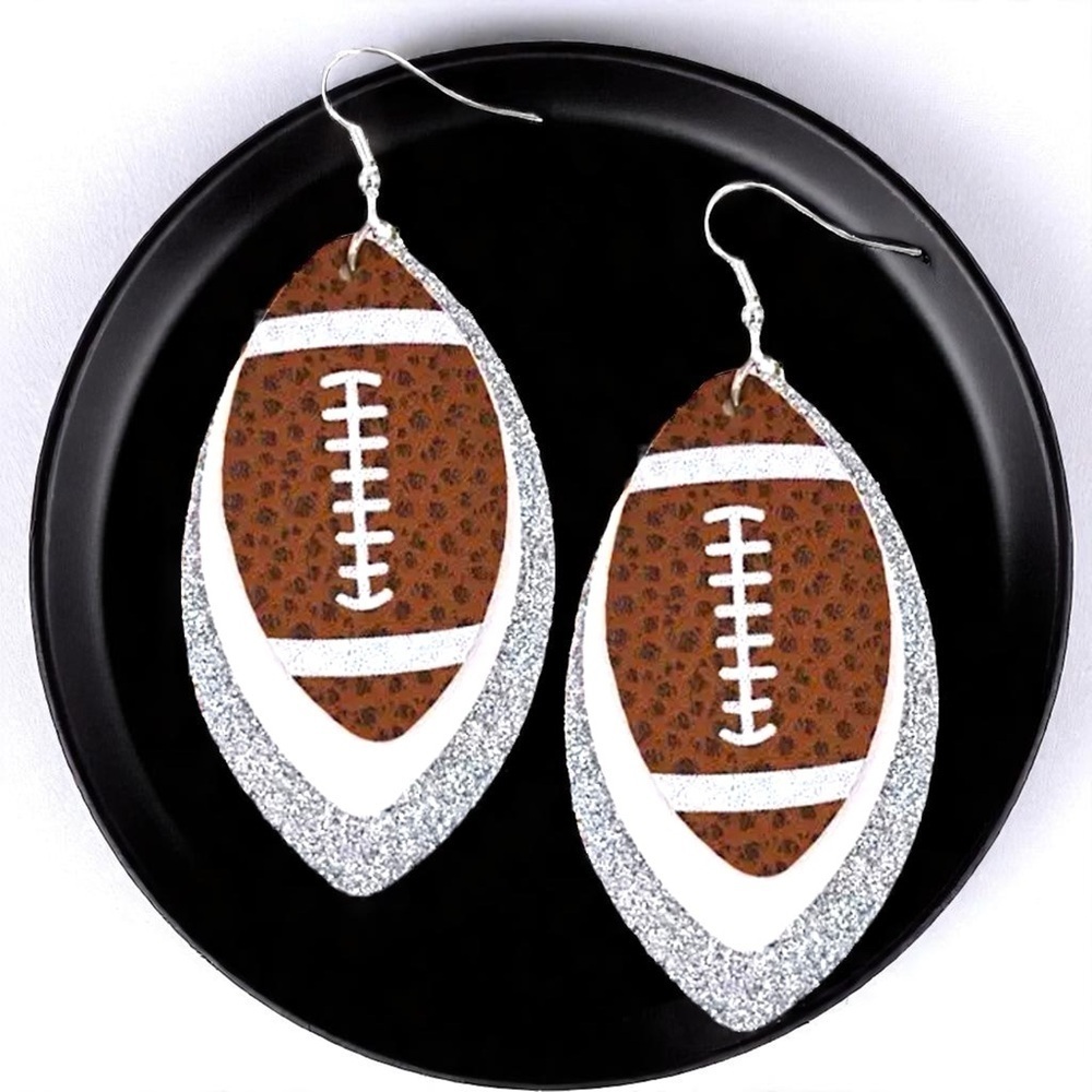 Game Day Glam: Silver and White Football Dangle Earrings for the Ultimate Fan!